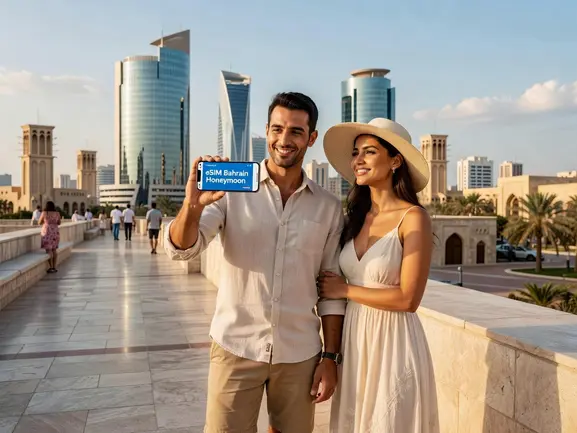 eSIM Bahrain honeymoon couple activating travel data plan on smartphone